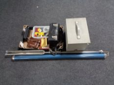 A cased projector, screen, box of Bell and Howell camera,