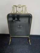 A brass Art Nouveau mirrored fire screen