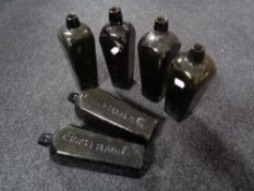 Six antique glass Dutch gin bottles