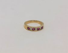 An 18ct gold ruby and diamond ring, size J CONDITION REPORT: 2.