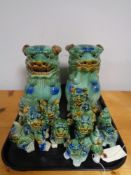 A tray of decorative Chinese dog figures