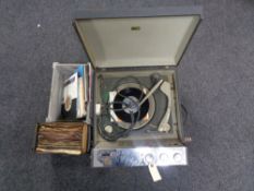 A mid century HMV monarch electric table top record player together with two small boxes of vinyl