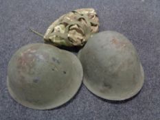 Two WW II steel helmets