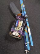 A pair of skis, ski poles,