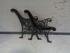 A pair of cast iron bench ends