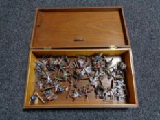 A mahogany box of military figures