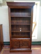 A set of sheesham wood bookshelves