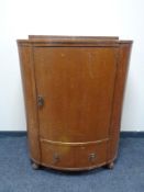 A 20th century bow fronted oak linen chest
