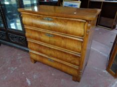A continental walnut four drawer chest