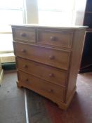 A pine five drawer chest