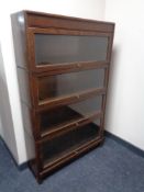 An Edwardian oak four tier stacking bookcase