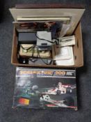 A box of scalextric set, cameras, Roberts radio,