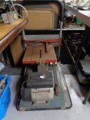 An electric table saw on flat bed trolley