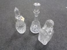 Three crystal decanters with stoppers