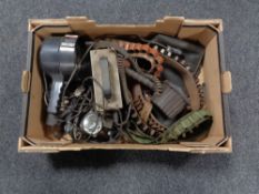 A box of ammunition belts, leather gun bag,