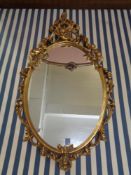 An ornate gilt framed mirror