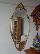 A decorative gilt framed mirror