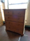 A pine five drawer chest