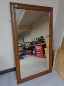 An oak framed wall mirror