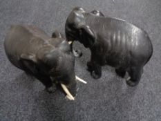 A pair of early 20th century carved eastern figures of elephants