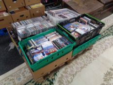 A pallet of nine boxes of assorted DVD's and CD's
