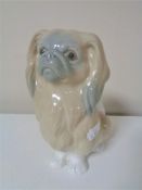 A Lladro figure the Pekingese dog.