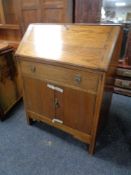 A 1930's oak writing bureau