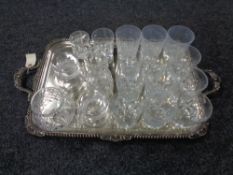 A silver plated twin handled serving tray together with glass ware, whisky tumblers,