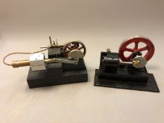 A live steam piston engine, length 25cm, together with another similar.