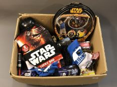A box of Star Wars related collectables and sundries including gift bags, hats and caps,
