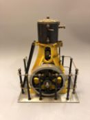 A vertical live steam piston engine, 24cm.