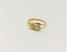 An 18ct gold double diamond cluster ring, 2.77g.