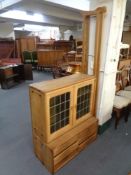 A blonde oak modular unit fitted with cupboards and drawers