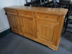 A pine three door three drawer sideboard