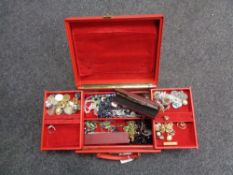 A fitted red jewellery box (with key) containing two 