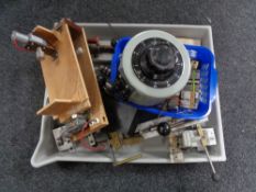 A large plastic tray of electrical motor and component parts