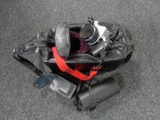 A camera bag containing Pentax ME Super camera with lens and accessories