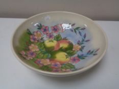 A Moorcroft spring blossom and fruit patterned bowl, width 26 cm.