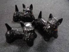 A tray of three pottery Scotty dogs