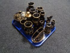 A tray of Grecian black and gilt pottery.