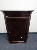 A Victorian style mahogany corner cabinet