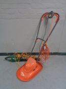 A Performance hedge trimmer and a Flymo mower