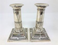 A pair of loaded silver candlesticks, maker T.A.S., Sheffield 1903, height 13.5cm.