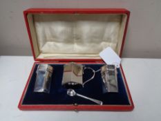 A silver cruet set, Birmingham 1898, Deakin & Francis, boxed.