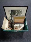 A plastic crate of pictures and prints, monochrome photograph,