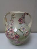 A Moorcroft spring blossom twin handled vase, height 26.5 cm.