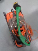 A Flymo Ultra Glide mower and a Performance strimmer