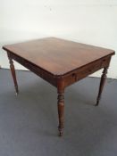 A mahogany kitchen table fitted a drawer