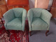 A pair of 20th century tub chairs in green floral fabric