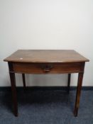 A 19th century mahogany writing table fitted a drawer